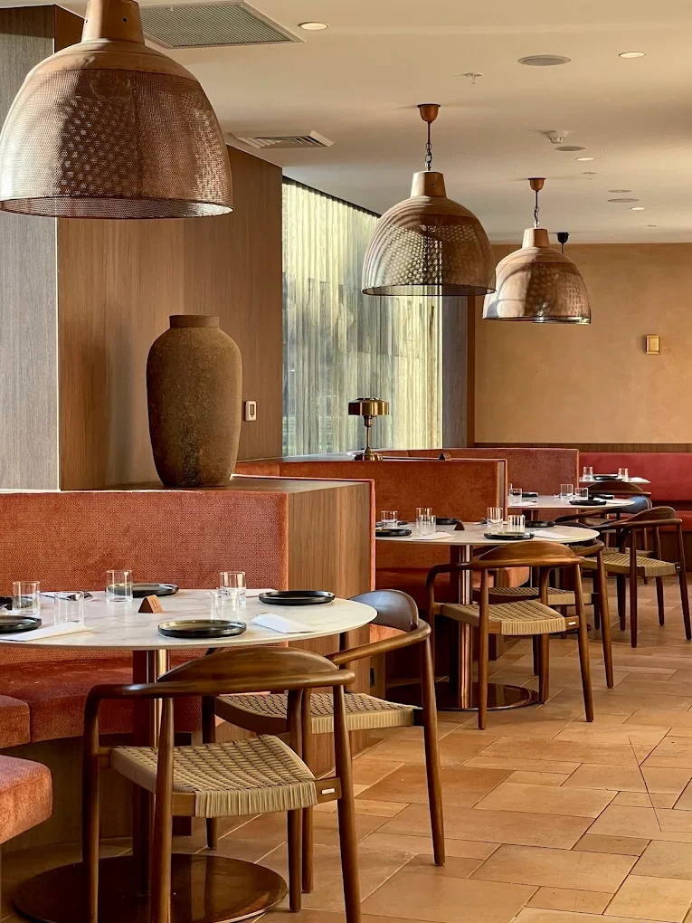 The copper-lit dining room at Maharajas